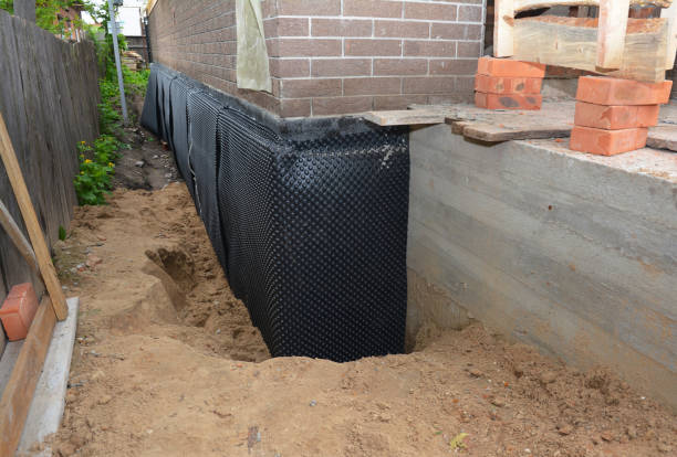 Happy homeowners after waterproofing job in Fosters